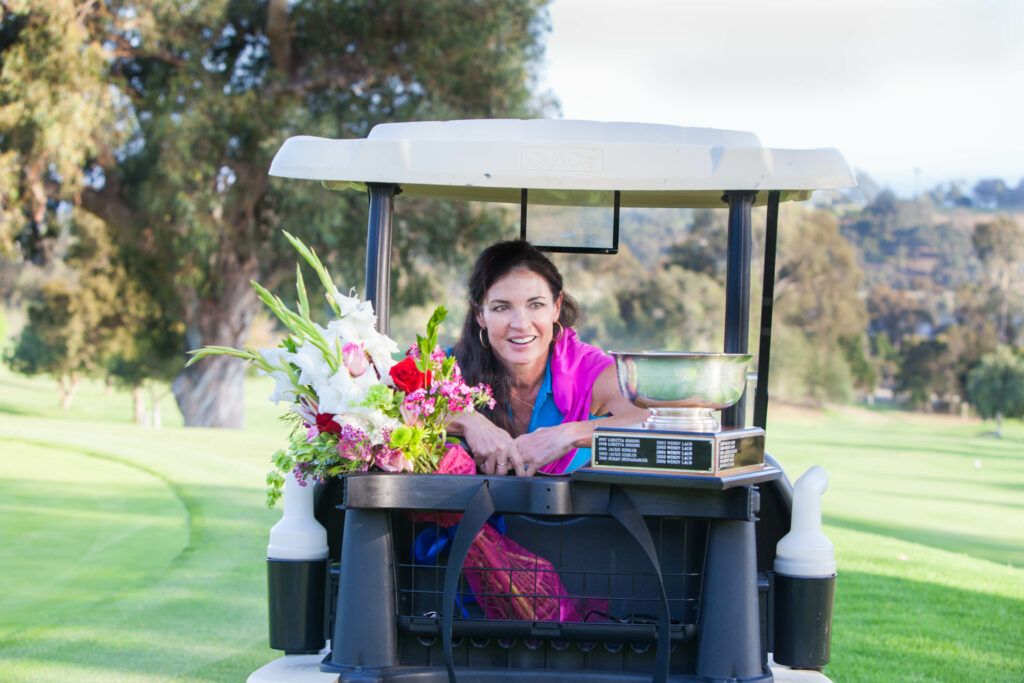 Woman on golf cart